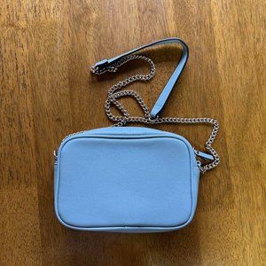 A pale blue shoulder bag
